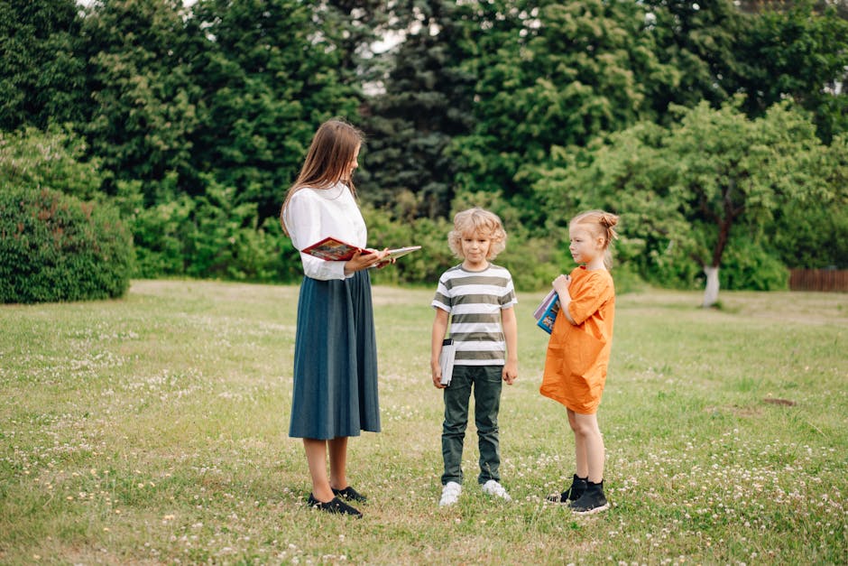 A woman teaching two children outdoors in a park, emphasizing learning in nature.